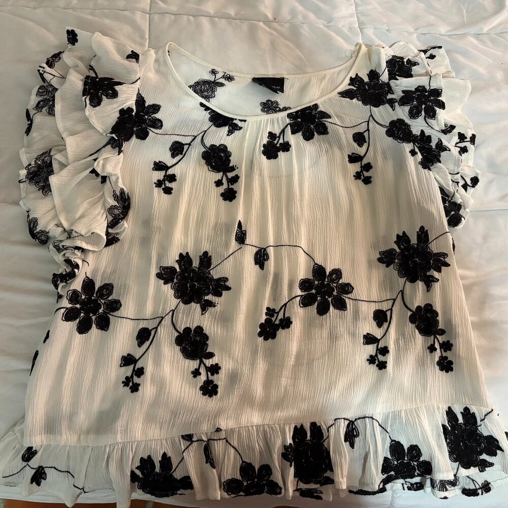 White blouse with embroidered flowers in black